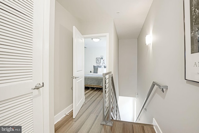 hall with light hardwood / wood-style floors