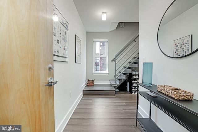 entryway with dark hardwood / wood-style floors