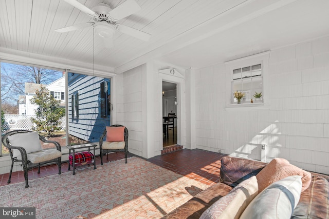 view of patio with ceiling fan and an outdoor living space