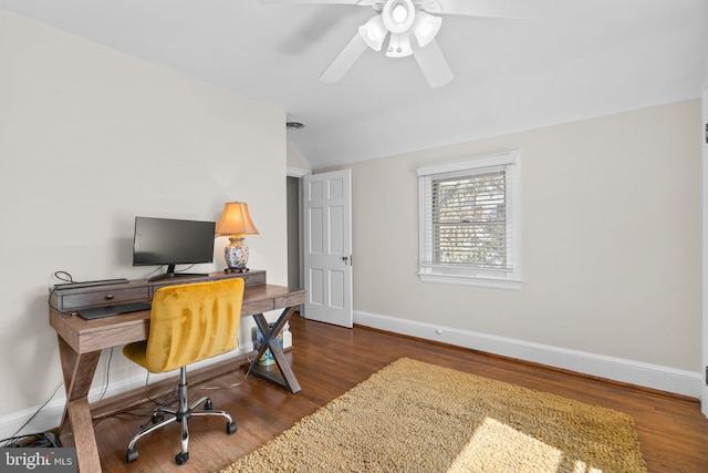 home office featuring a ceiling fan, lofted ceiling, baseboards, and wood finished floors