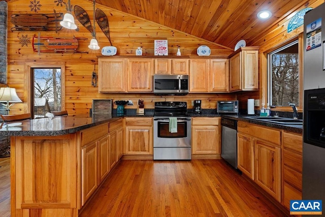 kitchen with vaulted ceiling, appliances with stainless steel finishes, pendant lighting, wooden ceiling, and light wood-type flooring