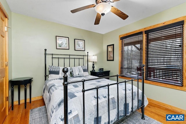 bedroom featuring hardwood / wood-style flooring and ceiling fan