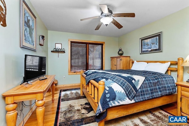 bedroom with ceiling fan and light wood-type flooring