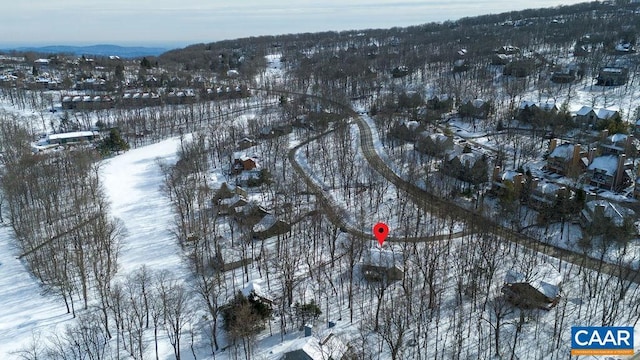 snowy aerial view with a mountain view