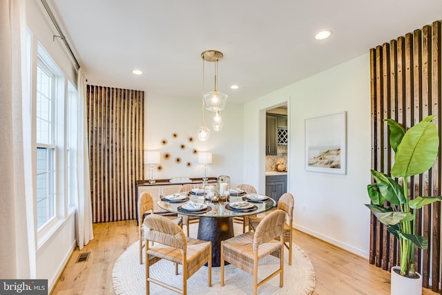 dining area with light wood-type flooring