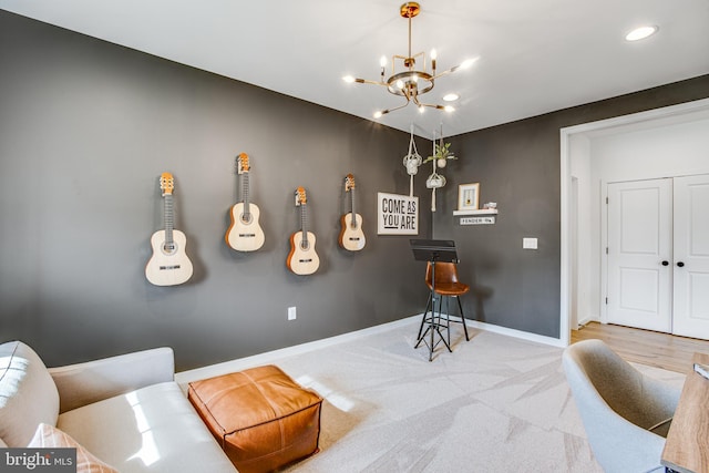 rec room with light carpet and a chandelier