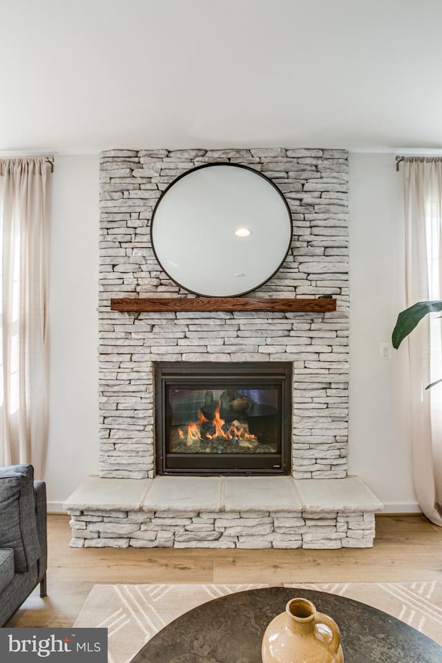 interior details with hardwood / wood-style flooring and a fireplace