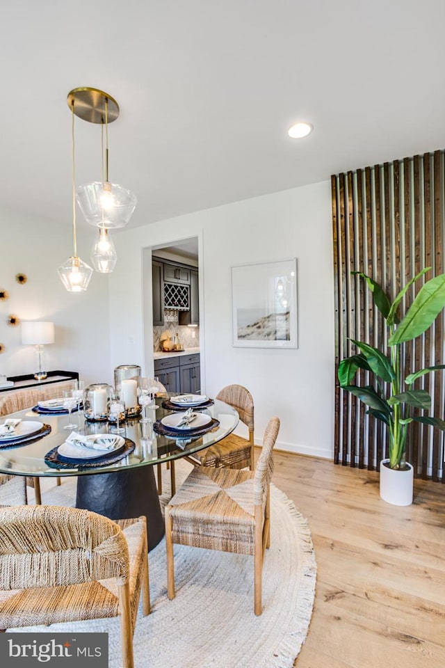 dining space with light wood-type flooring