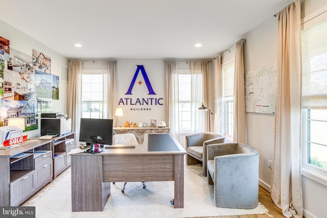 office space with light hardwood / wood-style floors
