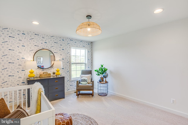 carpeted bedroom featuring a crib