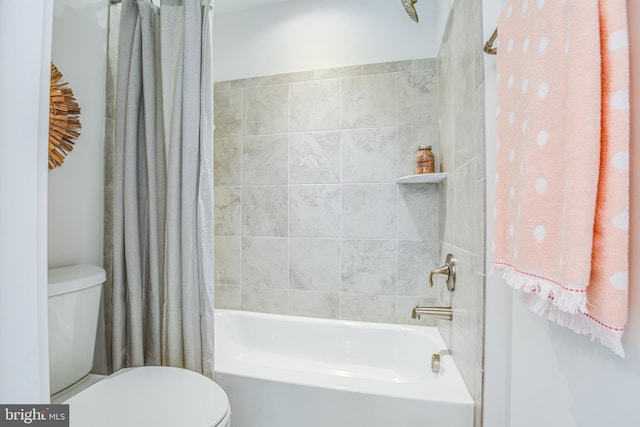 bathroom with shower / bath combination with curtain and toilet