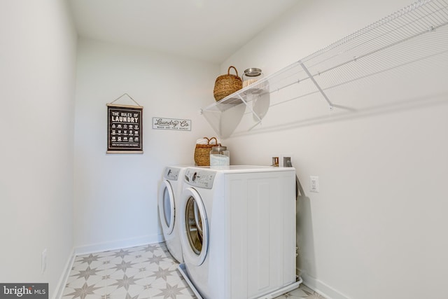 clothes washing area with washing machine and clothes dryer