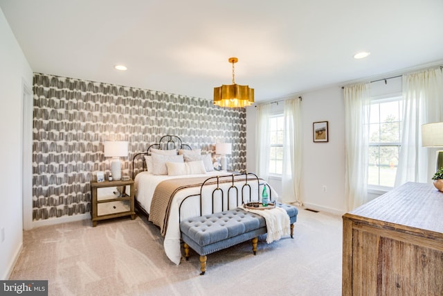 bedroom featuring light carpet