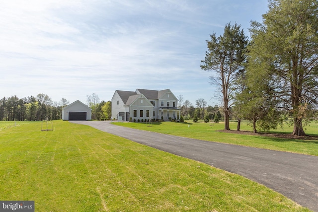 view of front facade featuring a garage and a front yard