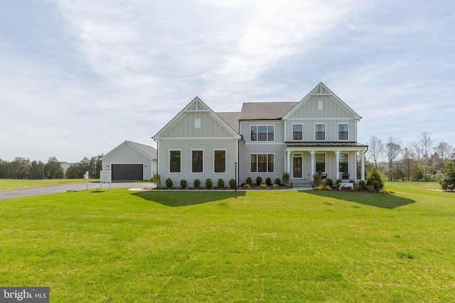 view of front facade with a porch, a garage, and a front lawn