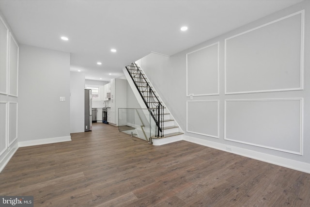 unfurnished living room featuring dark hardwood / wood-style floors