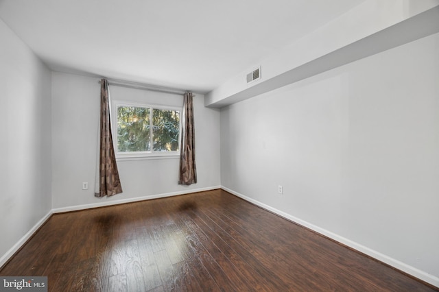 empty room featuring hardwood / wood-style floors