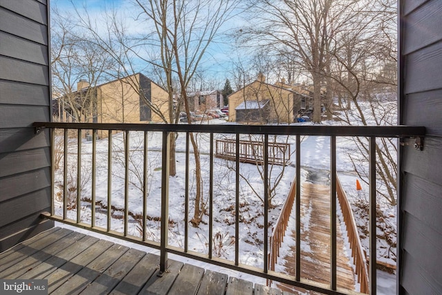 view of snow covered deck