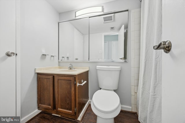 bathroom with vanity, a shower with curtain, and toilet