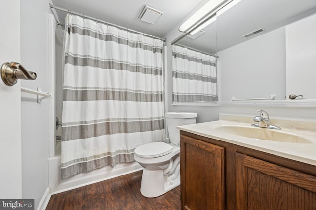 full bathroom featuring hardwood / wood-style flooring, vanity, toilet, and shower / bath combo