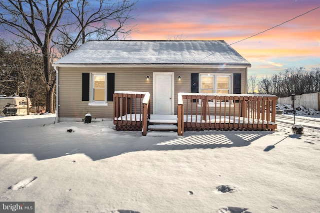 bungalow-style home featuring a deck