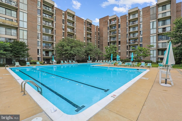 view of swimming pool with a patio