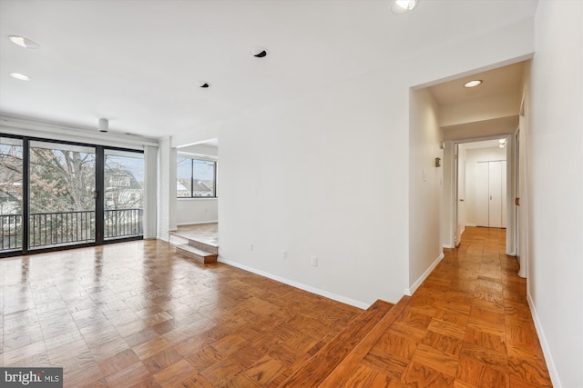 unfurnished room with parquet flooring