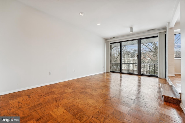 empty room featuring parquet flooring