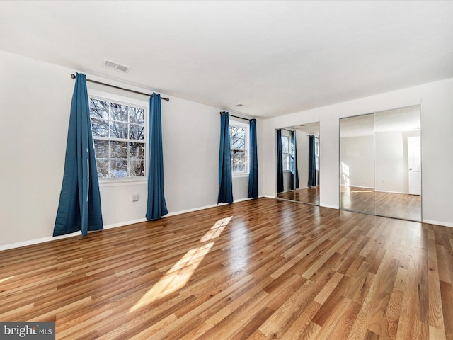 unfurnished room featuring light hardwood / wood-style flooring