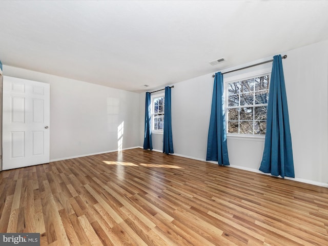 unfurnished room featuring light wood-type flooring