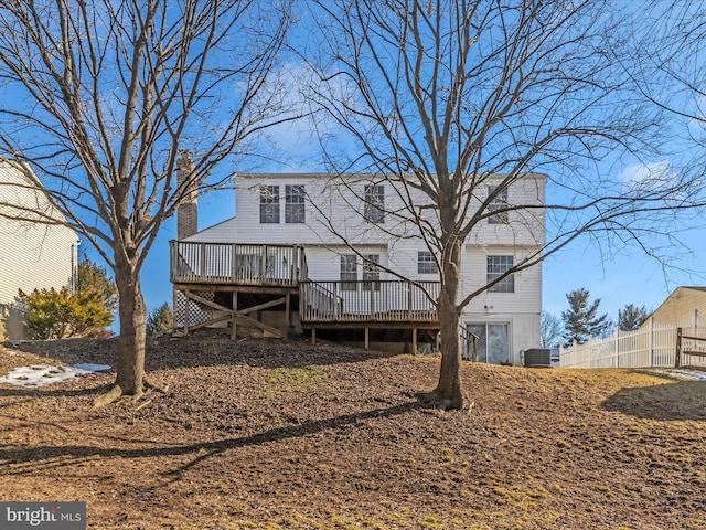 rear view of house featuring a deck