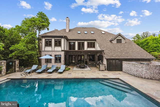 rear view of property featuring a patio