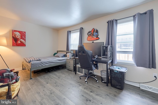 bedroom featuring hardwood / wood-style floors