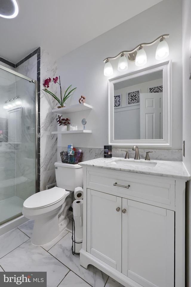 bathroom with vanity, toilet, and an enclosed shower