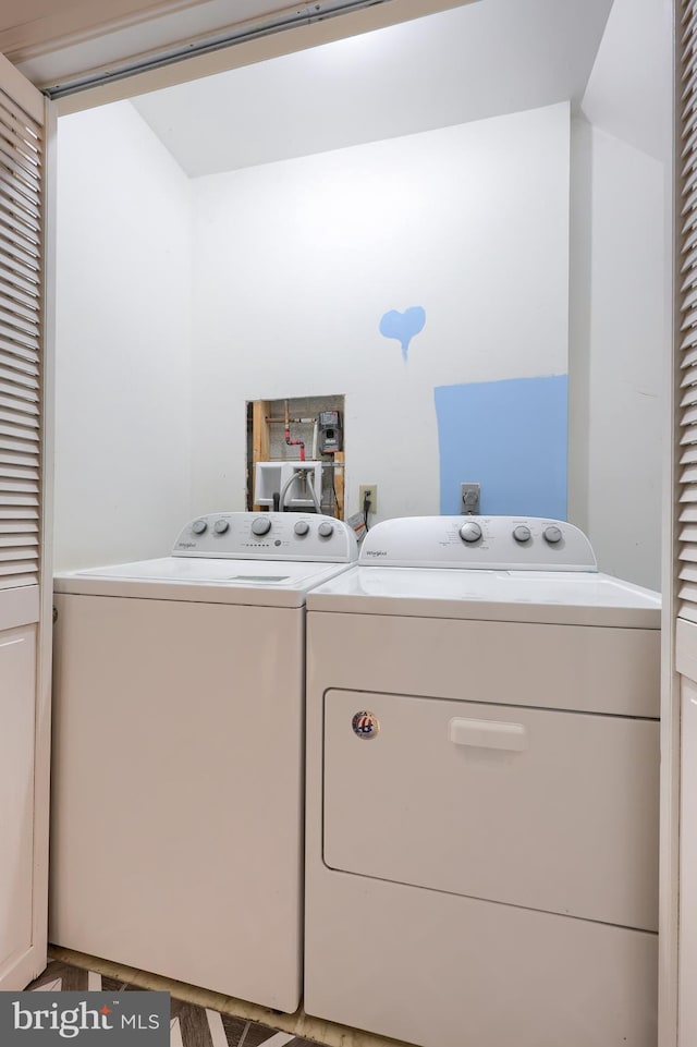 laundry room with separate washer and dryer