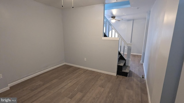 interior space featuring ceiling fan and dark hardwood / wood-style flooring