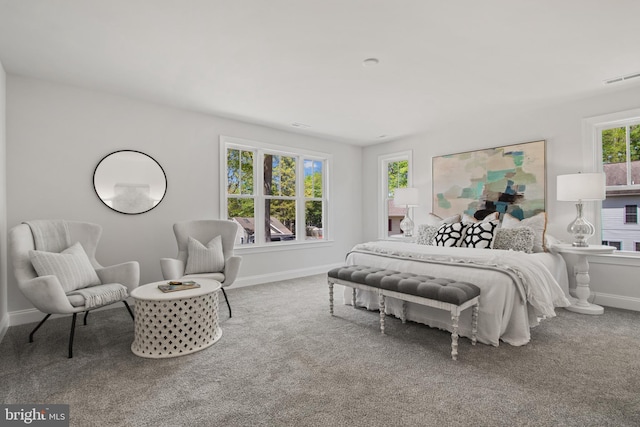 bedroom featuring carpet floors, baseboards, and visible vents