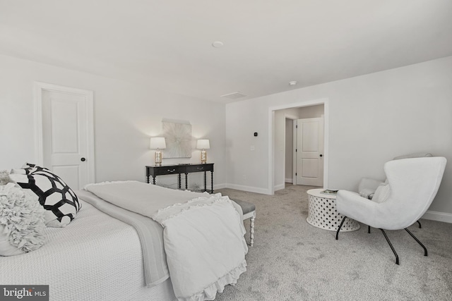 bedroom with carpet flooring and baseboards