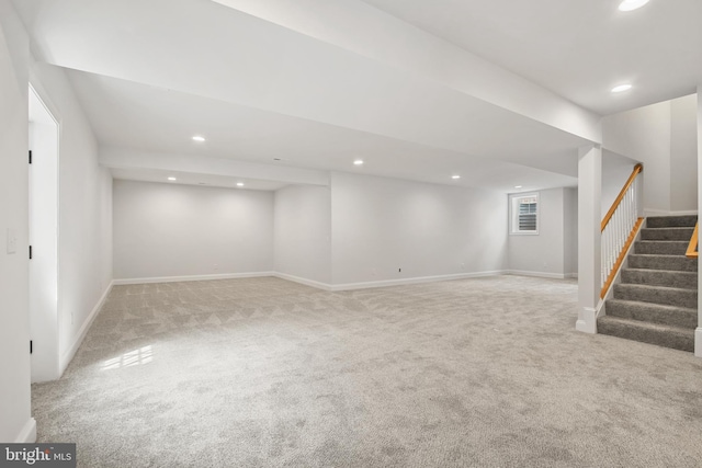 finished basement with baseboards, stairway, carpet flooring, and recessed lighting