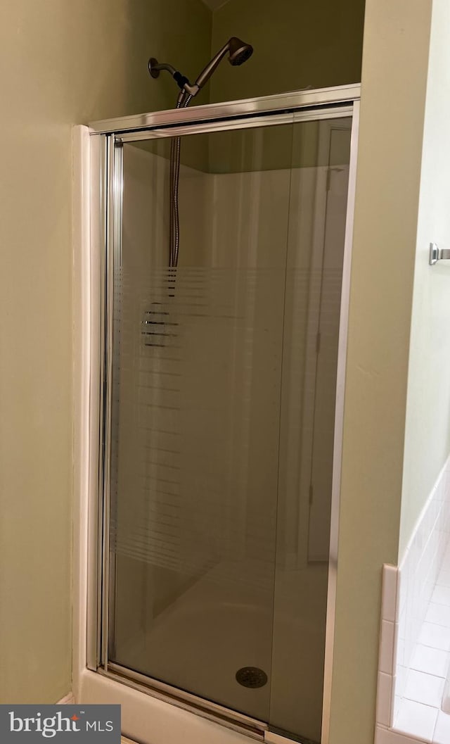 bathroom with an enclosed shower