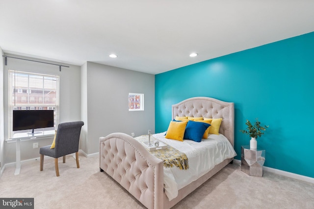 bedroom with light colored carpet