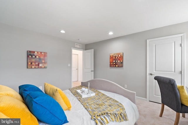 bedroom featuring light colored carpet