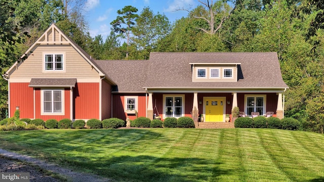 view of front facade with a porch and a front lawn