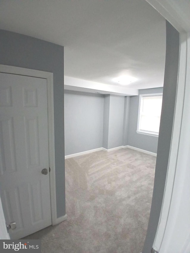 basement with light colored carpet