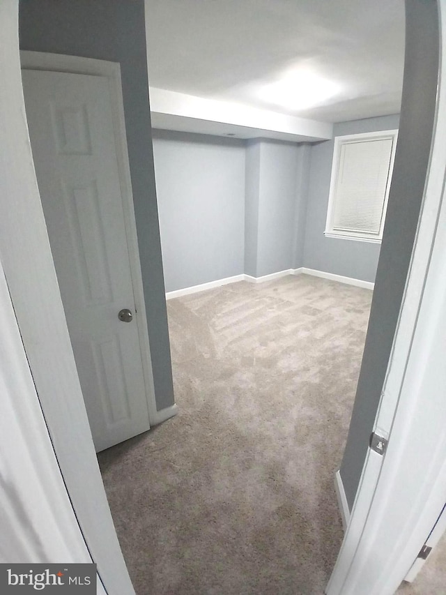 finished basement with carpet flooring and baseboards