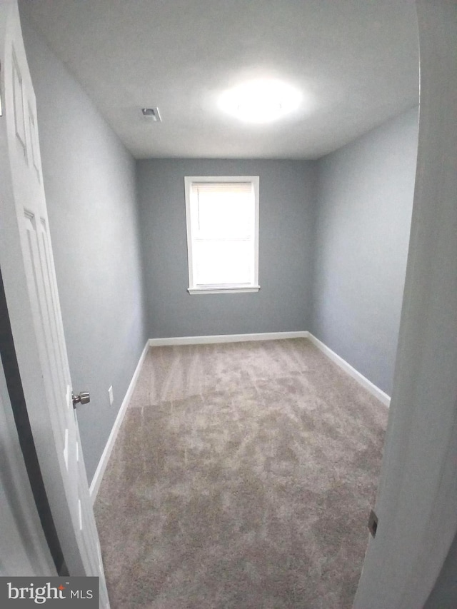 unfurnished room featuring carpet floors