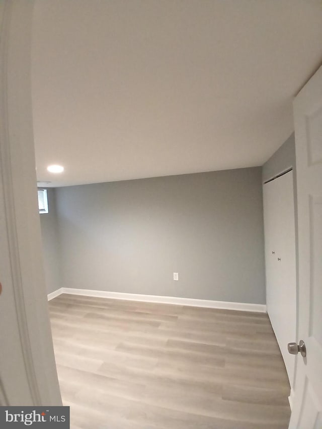 basement with wood-type flooring