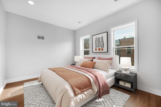 bedroom with wood-type flooring