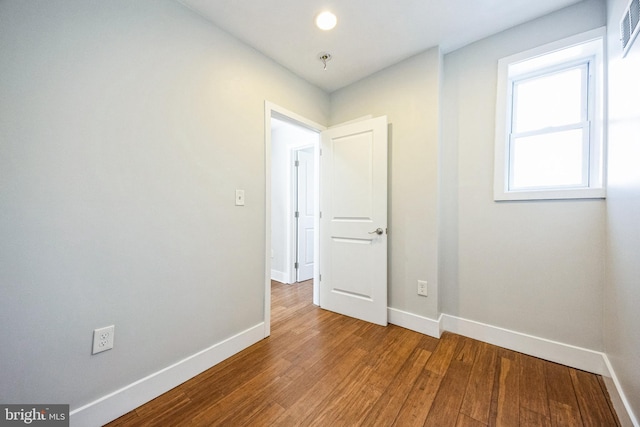 spare room featuring hardwood / wood-style flooring