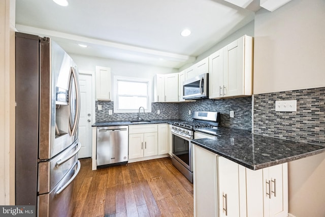 kitchen featuring white cabinetry, appliances with stainless steel finishes, and sink